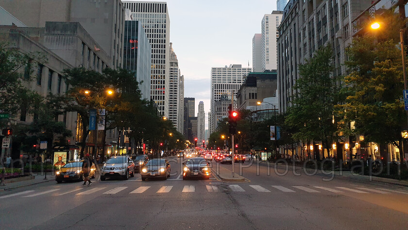 Chicago street 
 Street scene in Chicago USA downtown at dusk. 
 Keywords: dusk, downtown, chicago, cars, street,