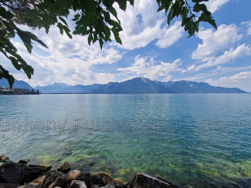 Mountain range 
 Looking out over Lake Geneva at teh mountains. 
 Keywords: water, lake, landscape, mountain range, france,