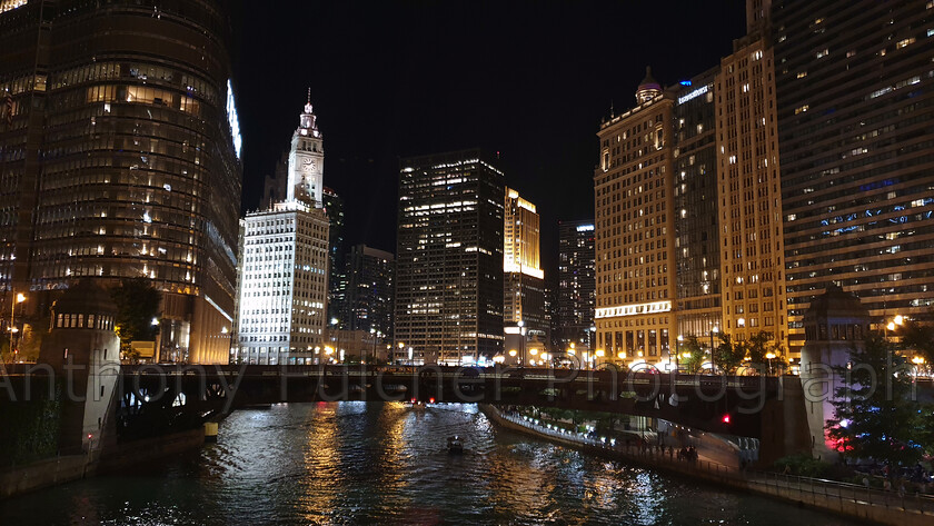 Chicago at night 
 skyline shot of Chicago, USA from the river at night. 
 Keywords: chicago, usa, river, cityline, cityscape, landscape, night, dark, travel