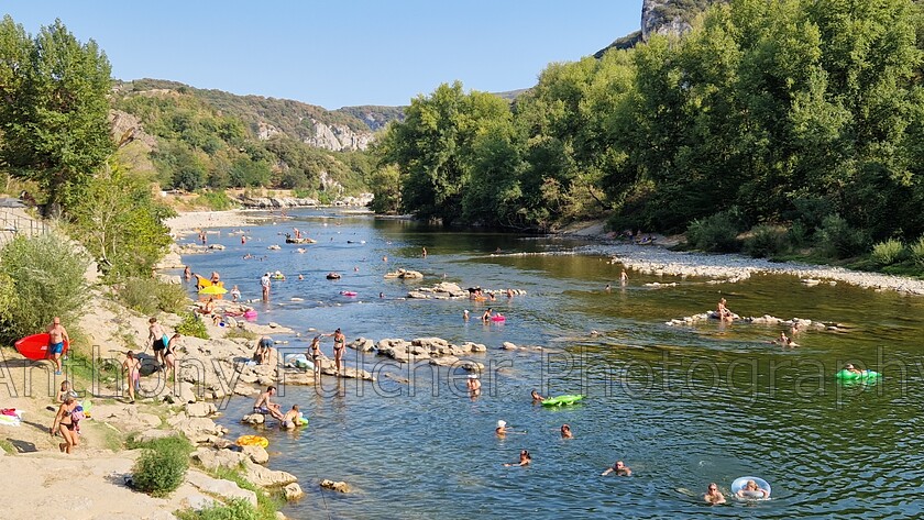 Ardeche river 
 The River Ardeche in France on an August summers day. kayakers and swimmers 
 Keywords: swimming, kayak, canoe, river, fun, summer, france, ardeche, pont d'arc,