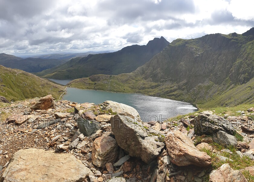 Snowdon NP - Wales 
 A view walking back down from Mount Snowdon, Snowdonia national park, wales. 
 Keywords: snowdon, mountain, landscape, view, water, lake, calm,