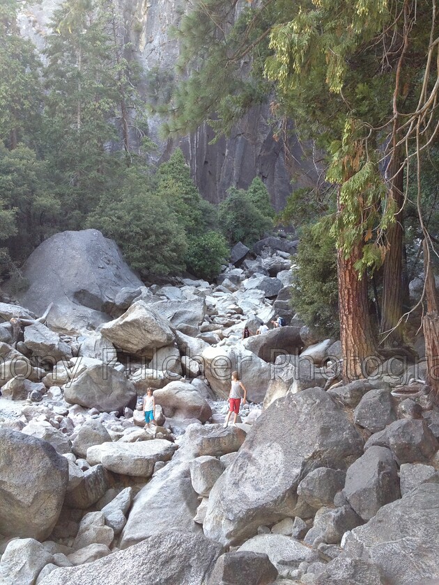 looking lost 
 My two boys on a river bed in the summer at Yosemite National park, USA 
 Keywords: river bed, summer, yosemite, national park, small,