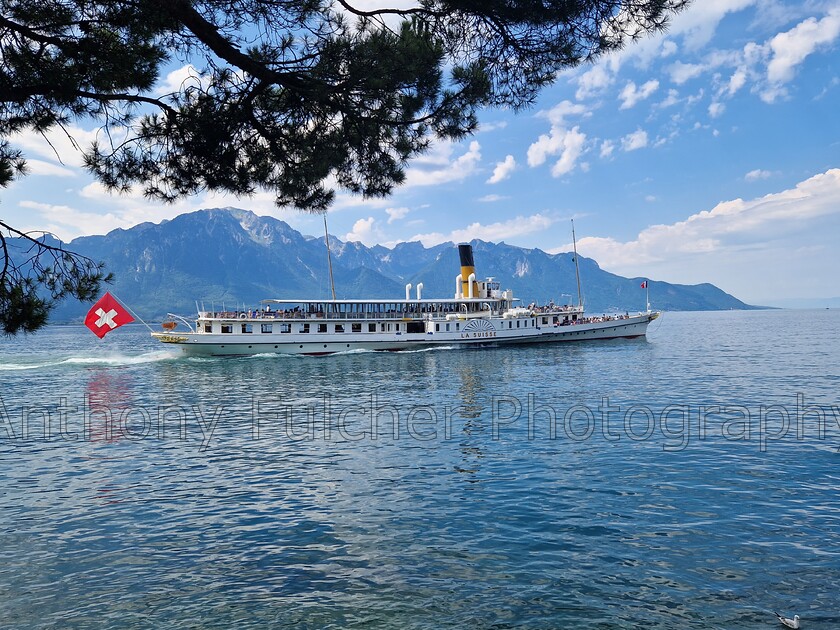 Steamer on Lake Geneva 
 Steamer crossing Lake Geneva in August 2022 
 Keywords: lake geneva, steamer, boat, geneva, france, switzerland, landscape, travel, travel photography, water,