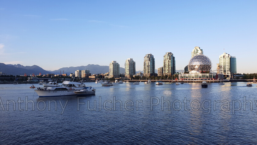 Science world 
 A view over the water looking at Science world in Vancouver, Canada. 
 Keywords: Landscape, cityscape, vancouver, canada, water, science world, blue,