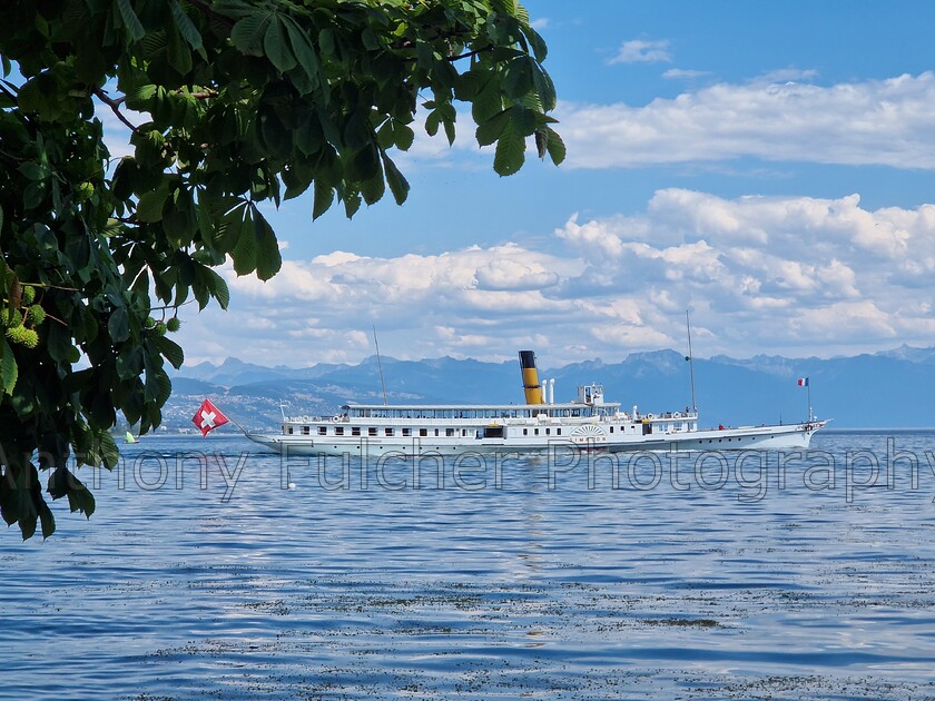 Paddle steamer 
 Paddle steamer on Lake Geneva from the French side. 
 Keywords: france, geneva, water, boating, ship, summer, landscape, peaceful,