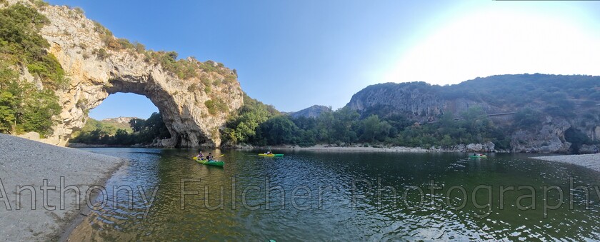 Kayaking 
 Kayaking down the river , View of Pont D'arc, a unesco world heritage site. In France 
 Keywords: france, Pont D'arc, river, kayaking, canoe, water, summer, landscape, travel,