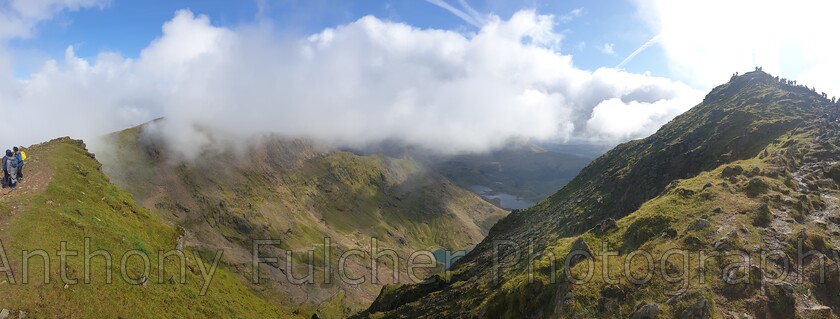 Snowdon - Wales 
 A view where Snowdon is on the right of the picture, you can see the lines of people going to the summit 
 Keywords: mountain, snowdon, wales, snowdonia, national park, uk, hikers, hiking, walk, landscape, clouds, weather,